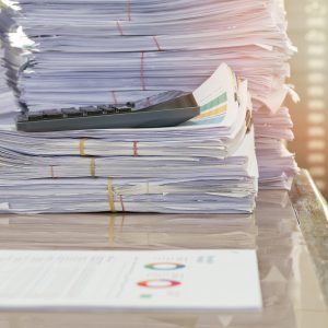 Close up of business documents stack on desk , report papers stack